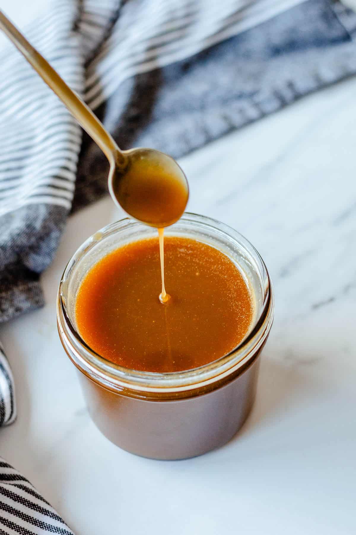 Caramel Sauce in a glass jar.