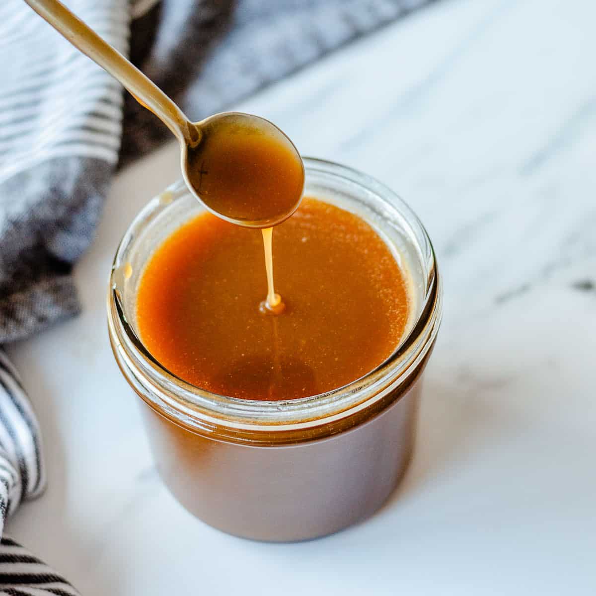 Caramel Sauce in a glass jar.