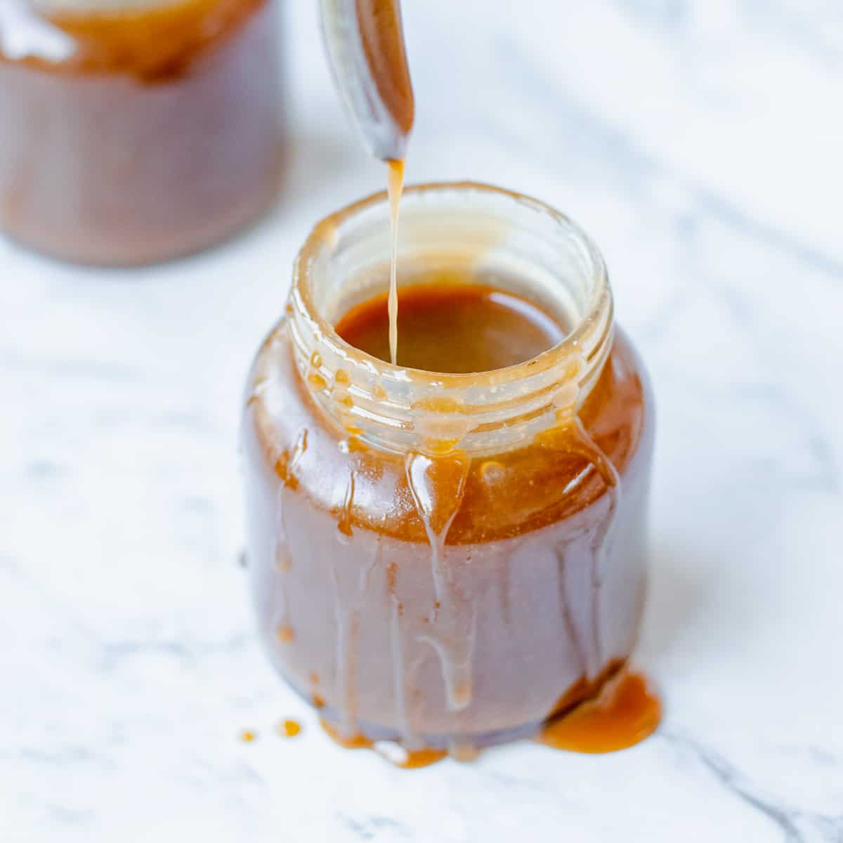 Caramel sauce in a glass jar