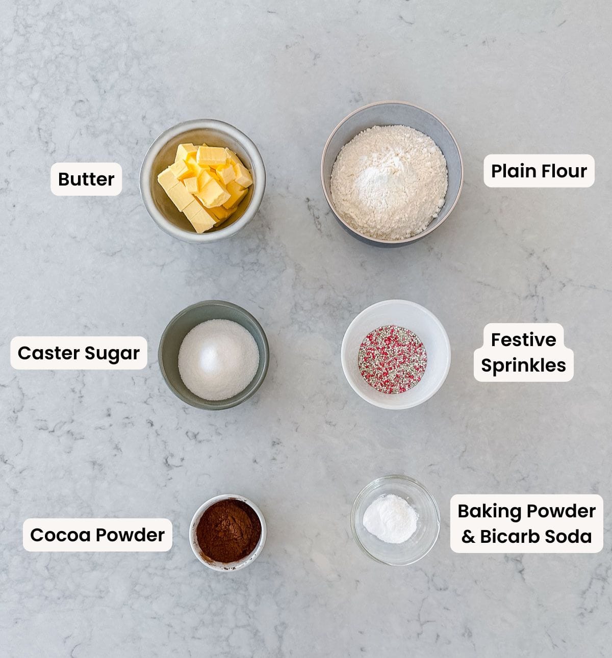 A collection of labelled ingredients needed to make festive chocolate cookies.