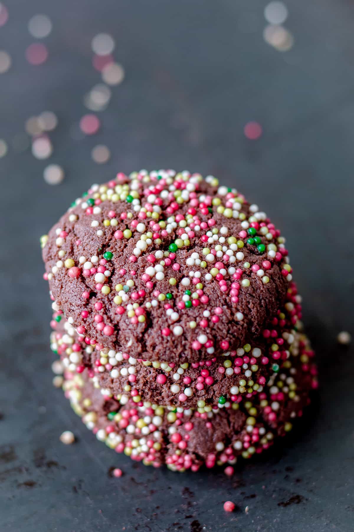 Chocolate cookies covered in festive sprinkles