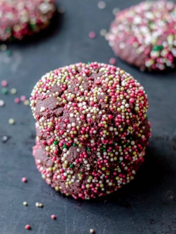 Christmas chocolate cookes covered in red, white and green spinkles