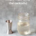 sugar syrup in glass jar with silver spirit measurer