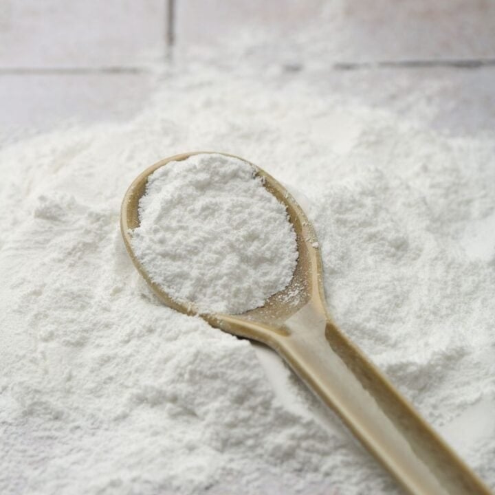 Close up image of icing sugar with a spoon.