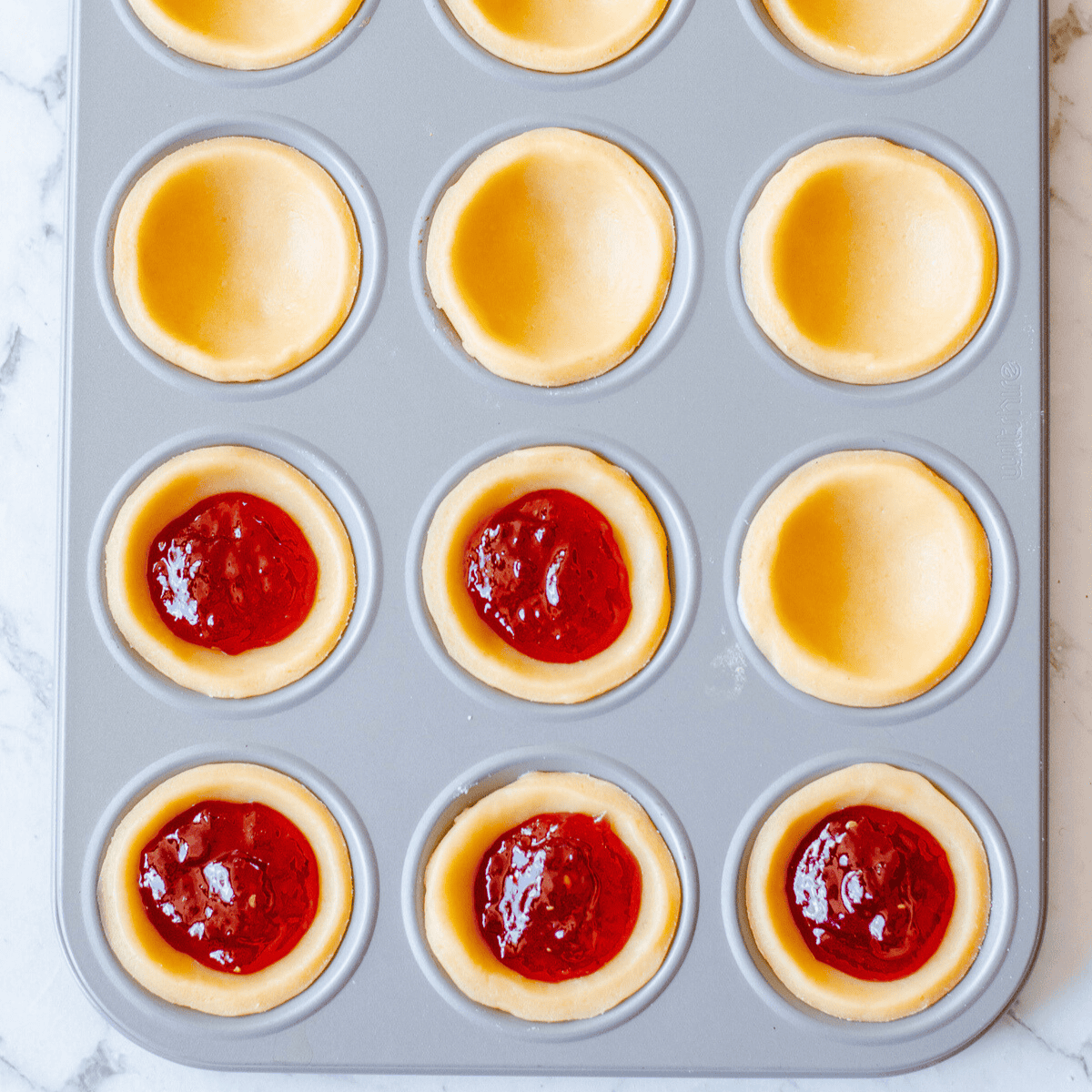 Jam Tarts in a patty pan.