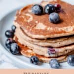pancakes with blueberries on blue plate graphic for pinterest