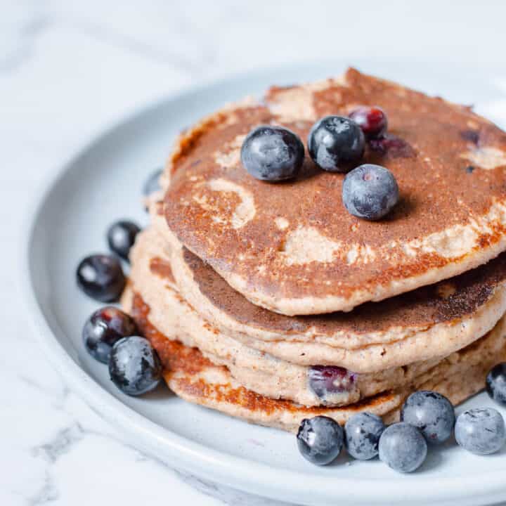 blueberry pancakes on blue plate