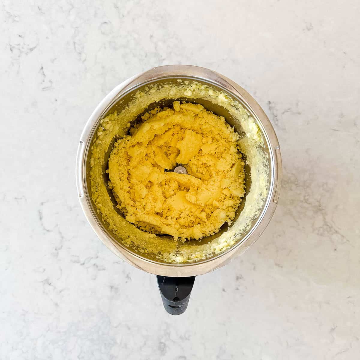 Pineapple pieces in a Thermomix jug.