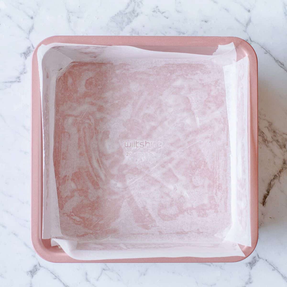 Square tin lined with baking paper.