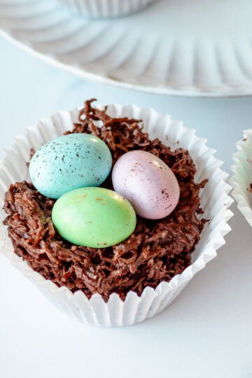 An easter egg nest sitting on a marble benchtop