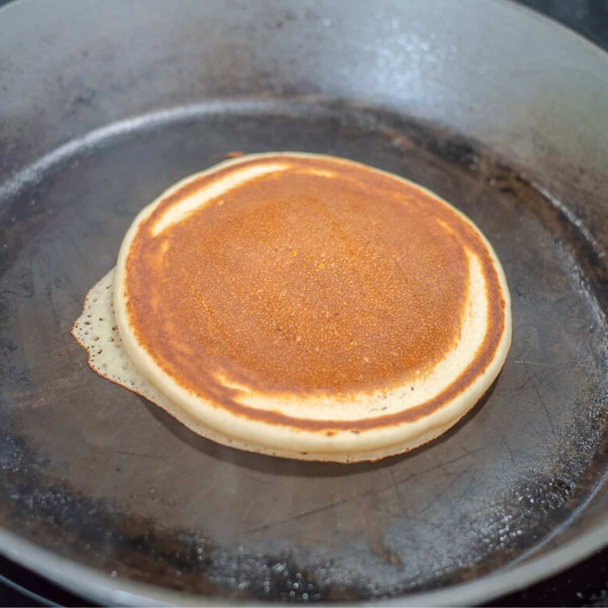 Pancake in a frying pan.