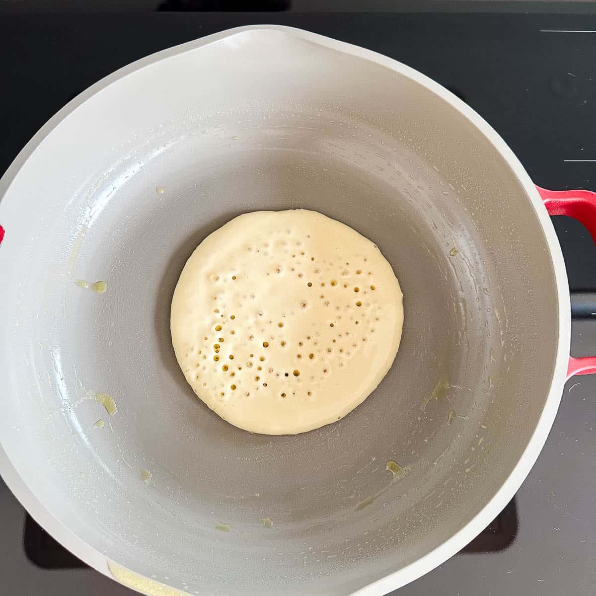 Pancake in a frying pan.