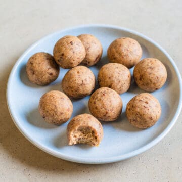 Chai protein balls on a blue plate.