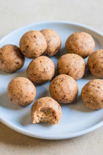 Chai protein balls on a blue plate.