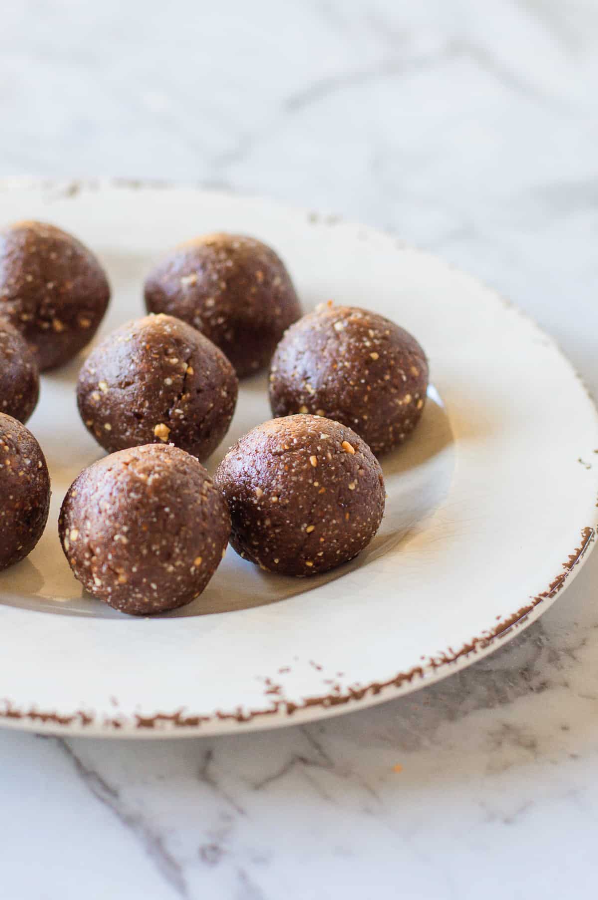 Peanut Butter Bliss Balls on a white plate.