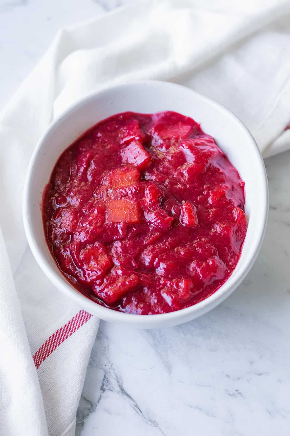 Stewed rhubarb in a white bowl.