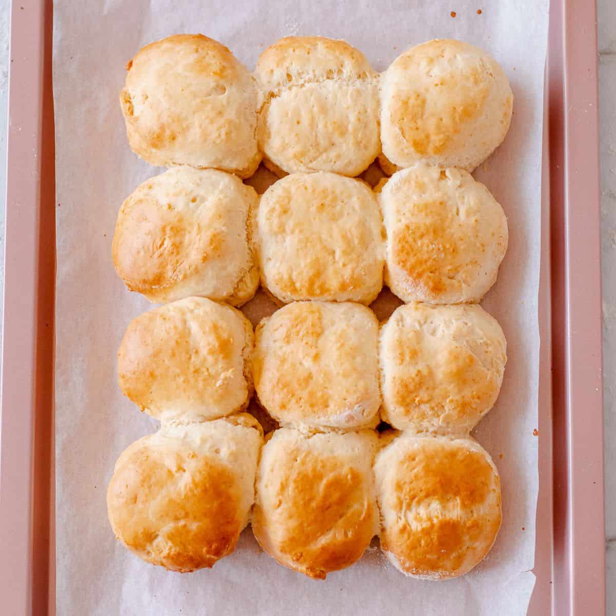 Baked scones on a baking tray.