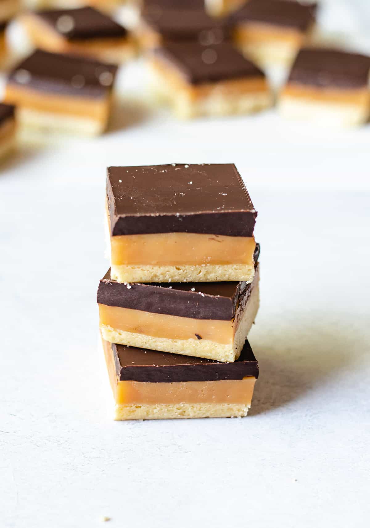 A stack of 3 caramel chocolate slices.