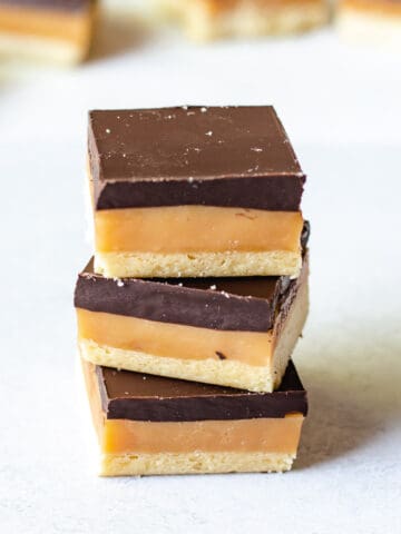 stack of 3 caramel slices on a white background.