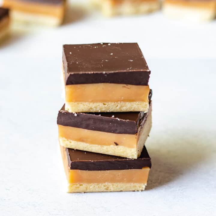 stack of 3 caramel slices on a white background.