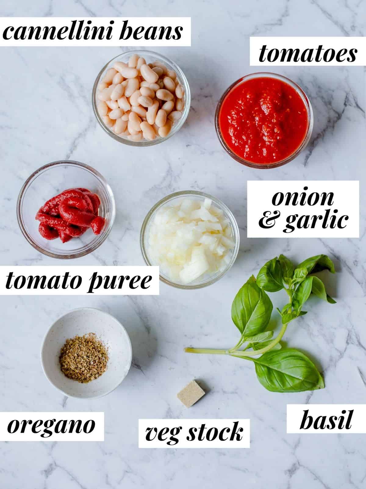 Ingredients to make a creamy white bean and tomato soup.