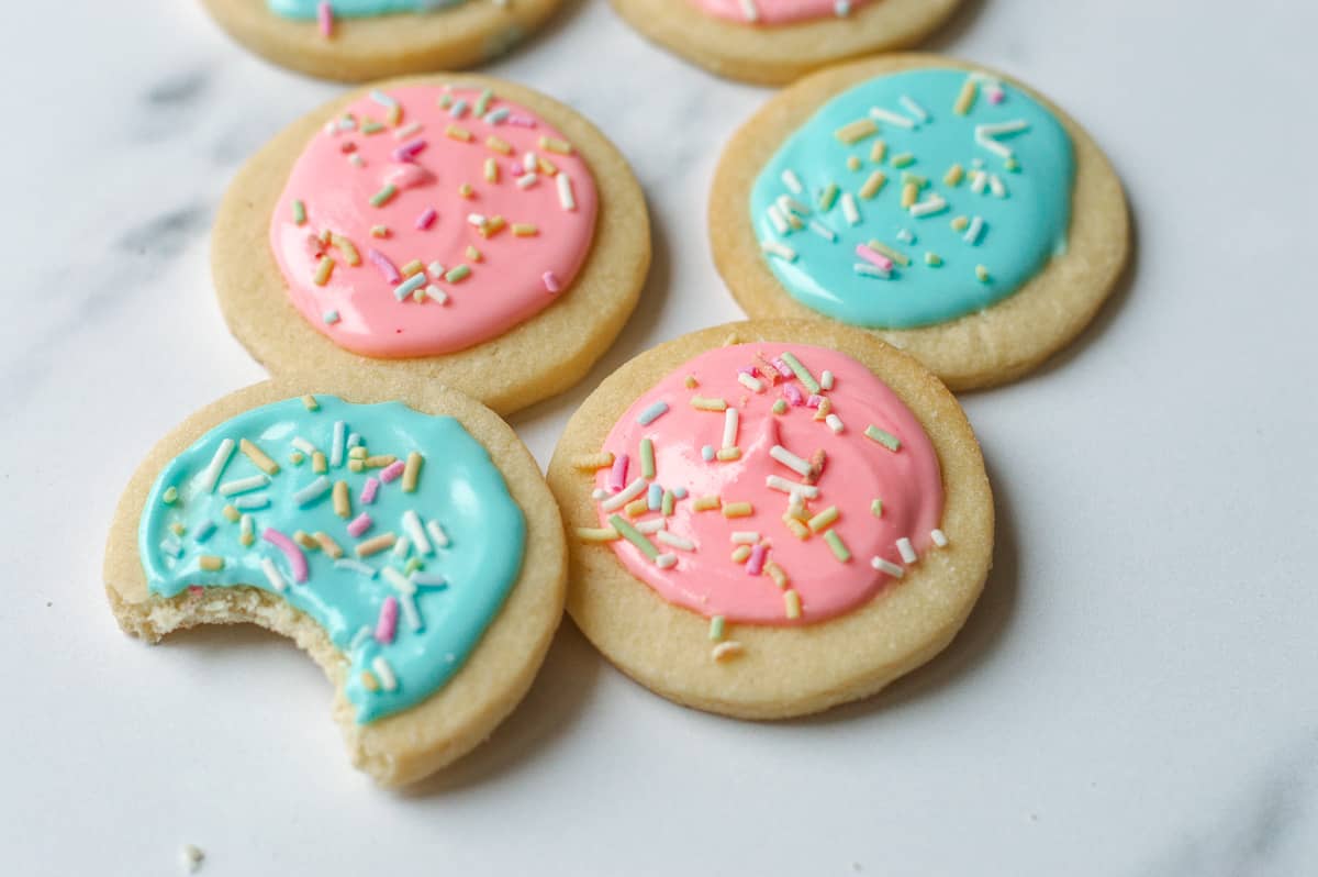 Close up image of sugar cookies with pink and blue icing.