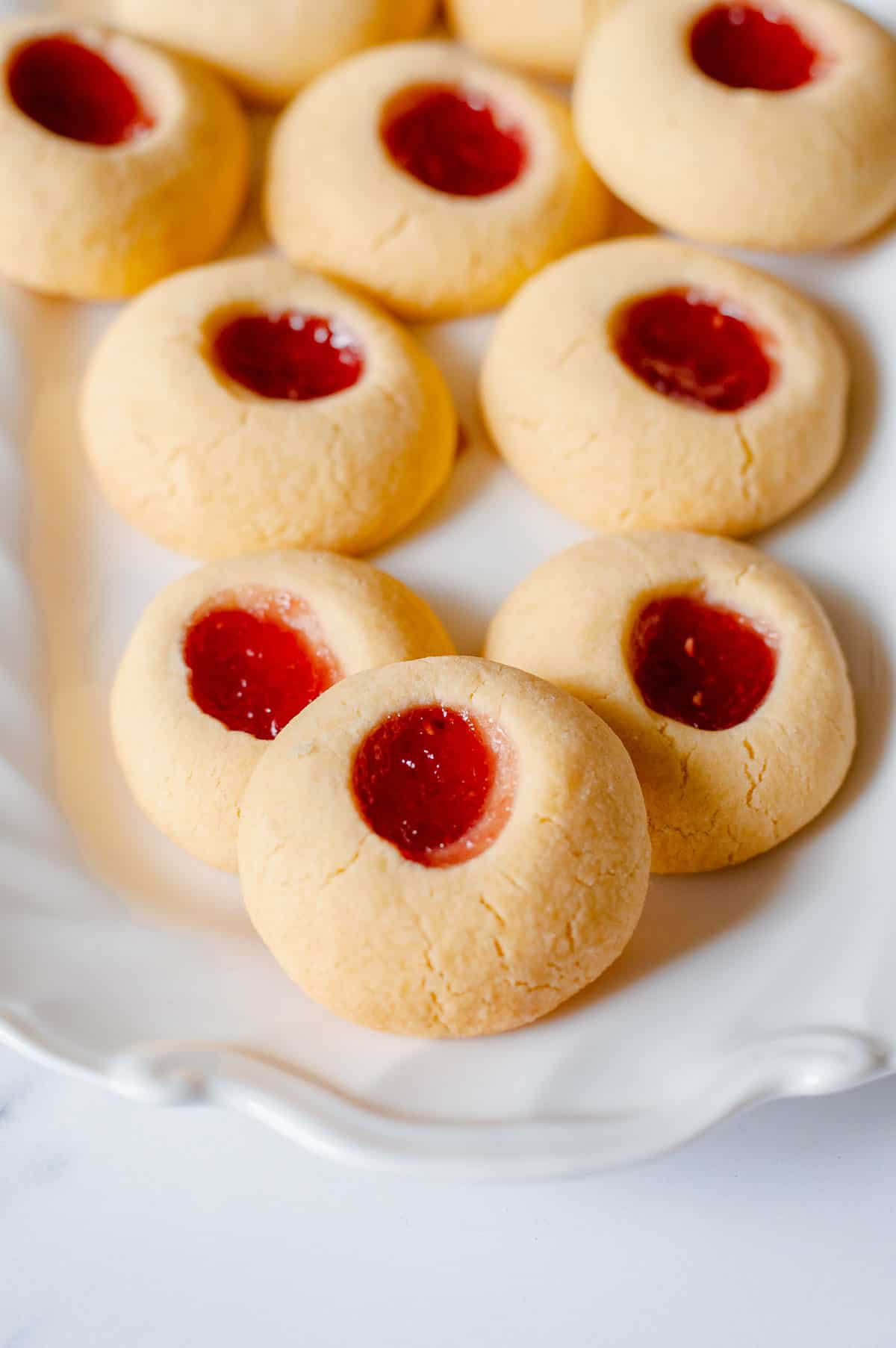 Close up image of homemade Jam Drops sitting on a white plate.