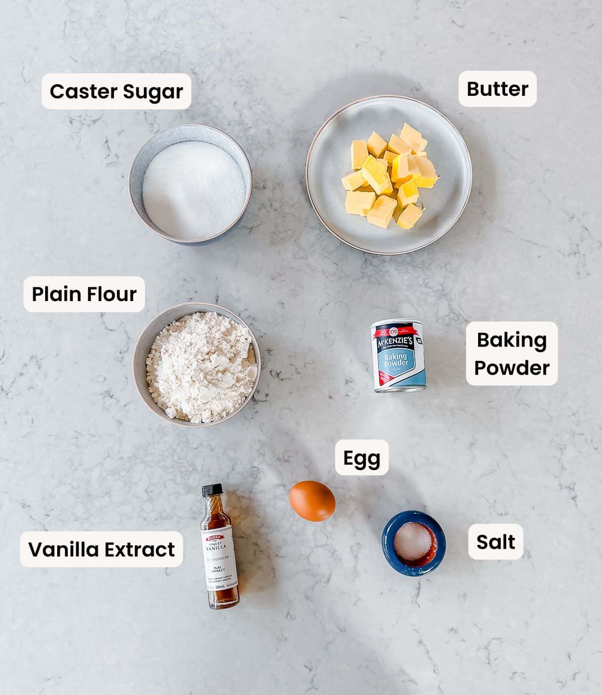 A collection of ingredients needed to make Sugar Cookies.