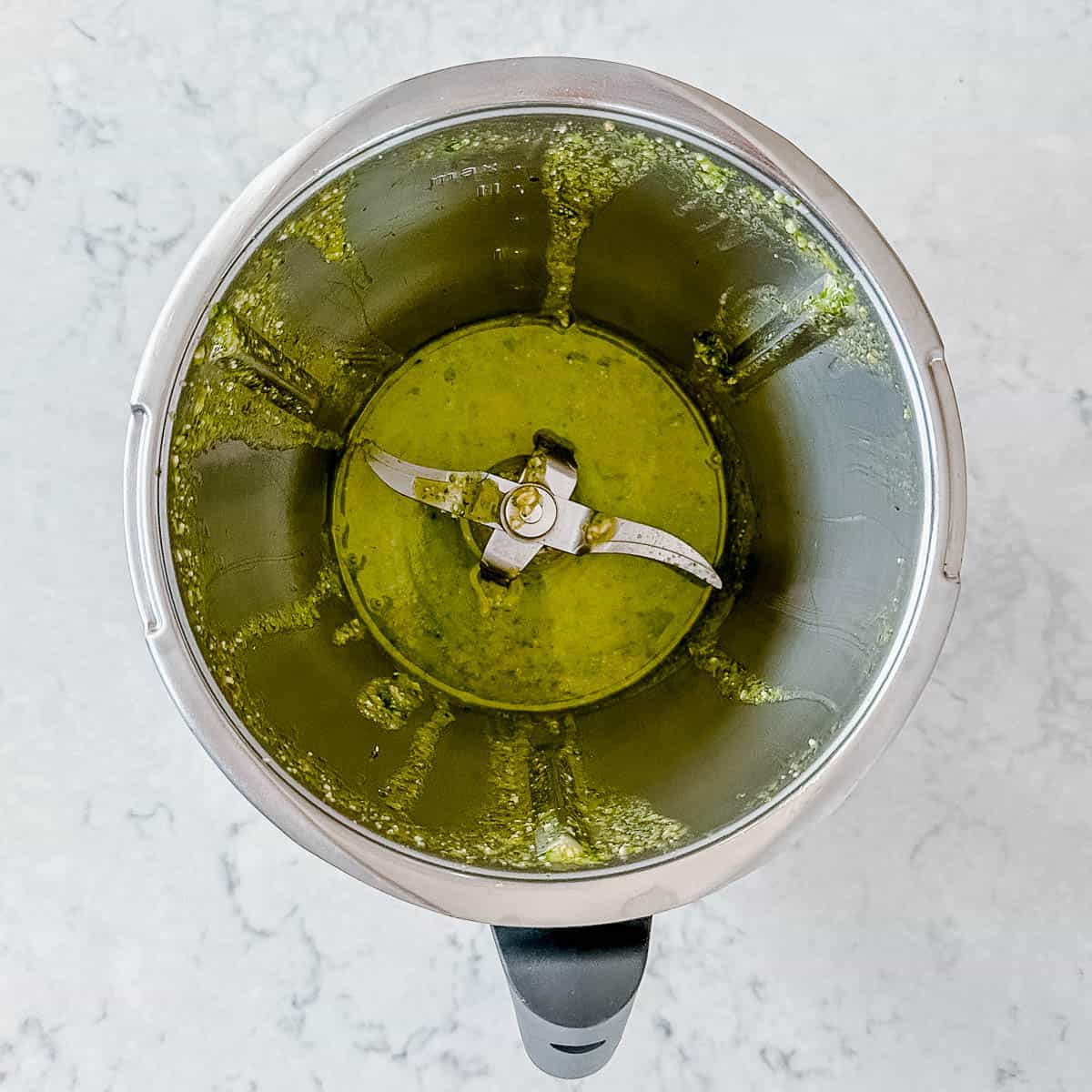 An image of Pesto being made in the Thermomix.
