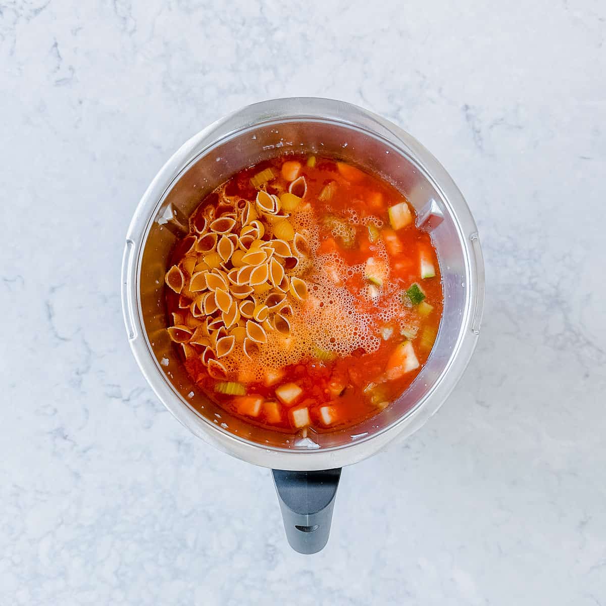 Homemade soup being made in a Thermomix Bowl.