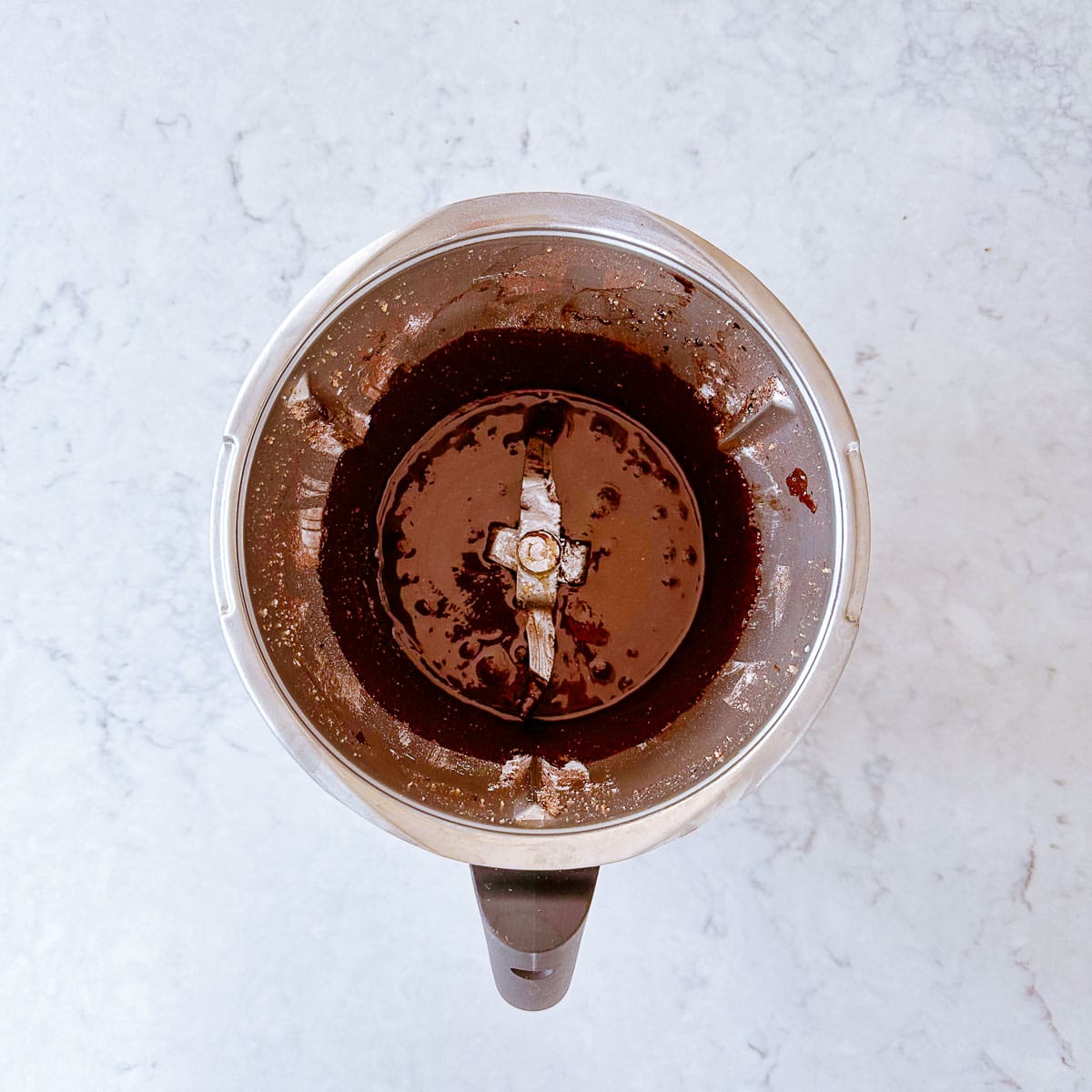 Runny nutella in a Thermomix bowl.