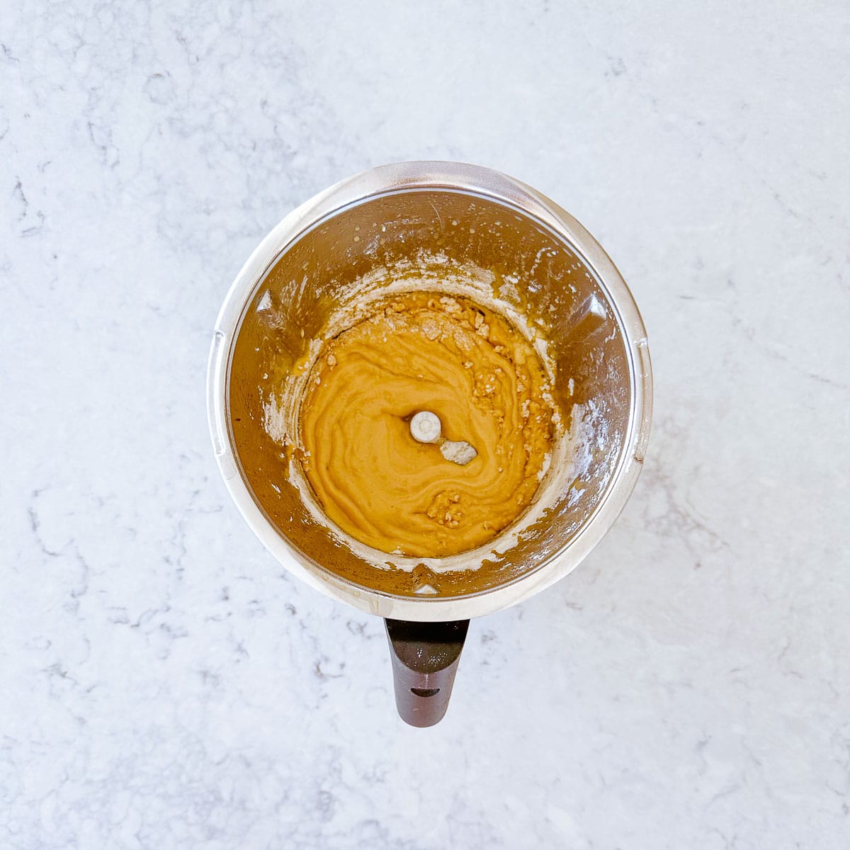 Cake batter in a Thermomix mixing bowl.