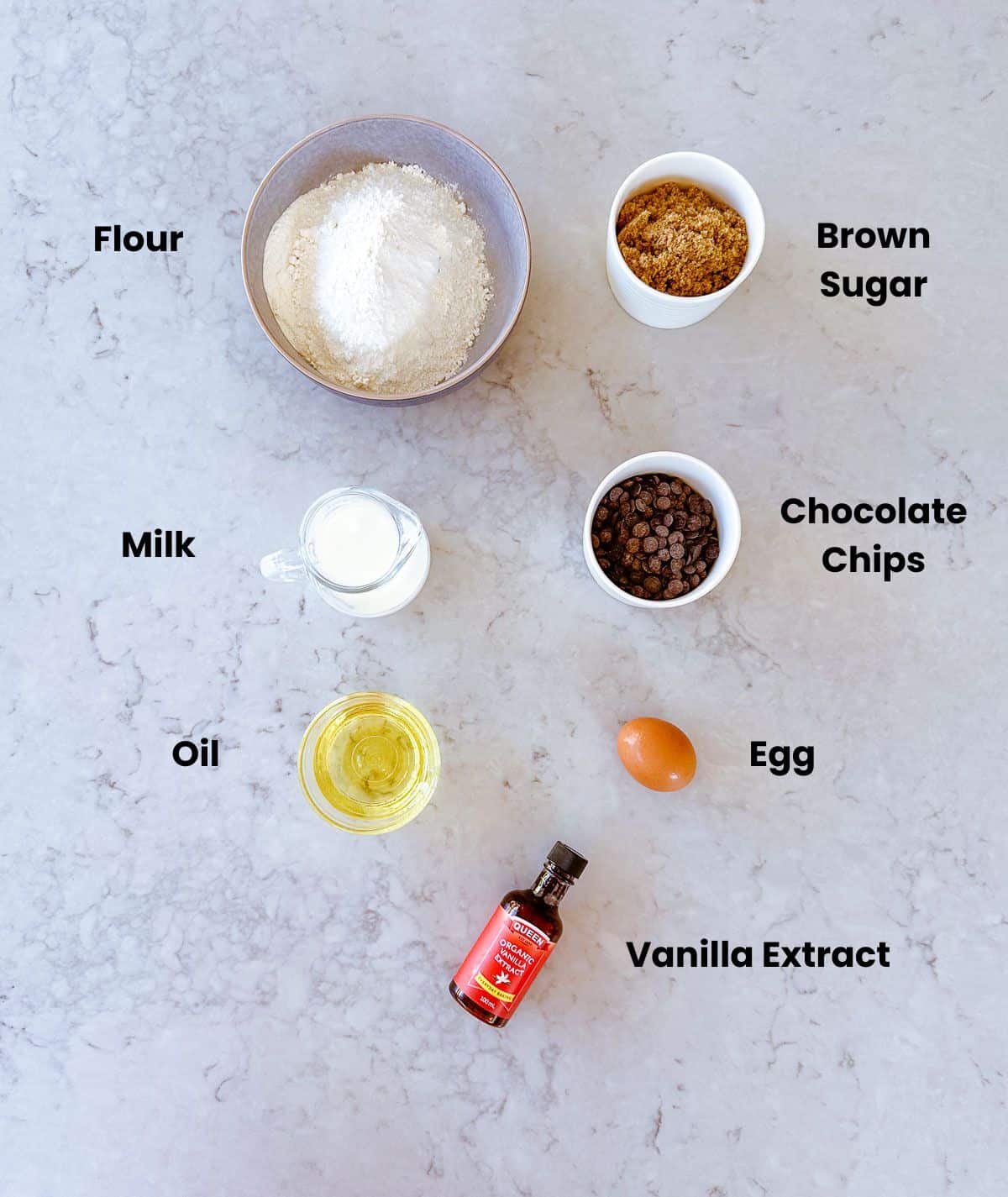 A collection of labelled ingredients needed to make Chocolate Chip Muffins.