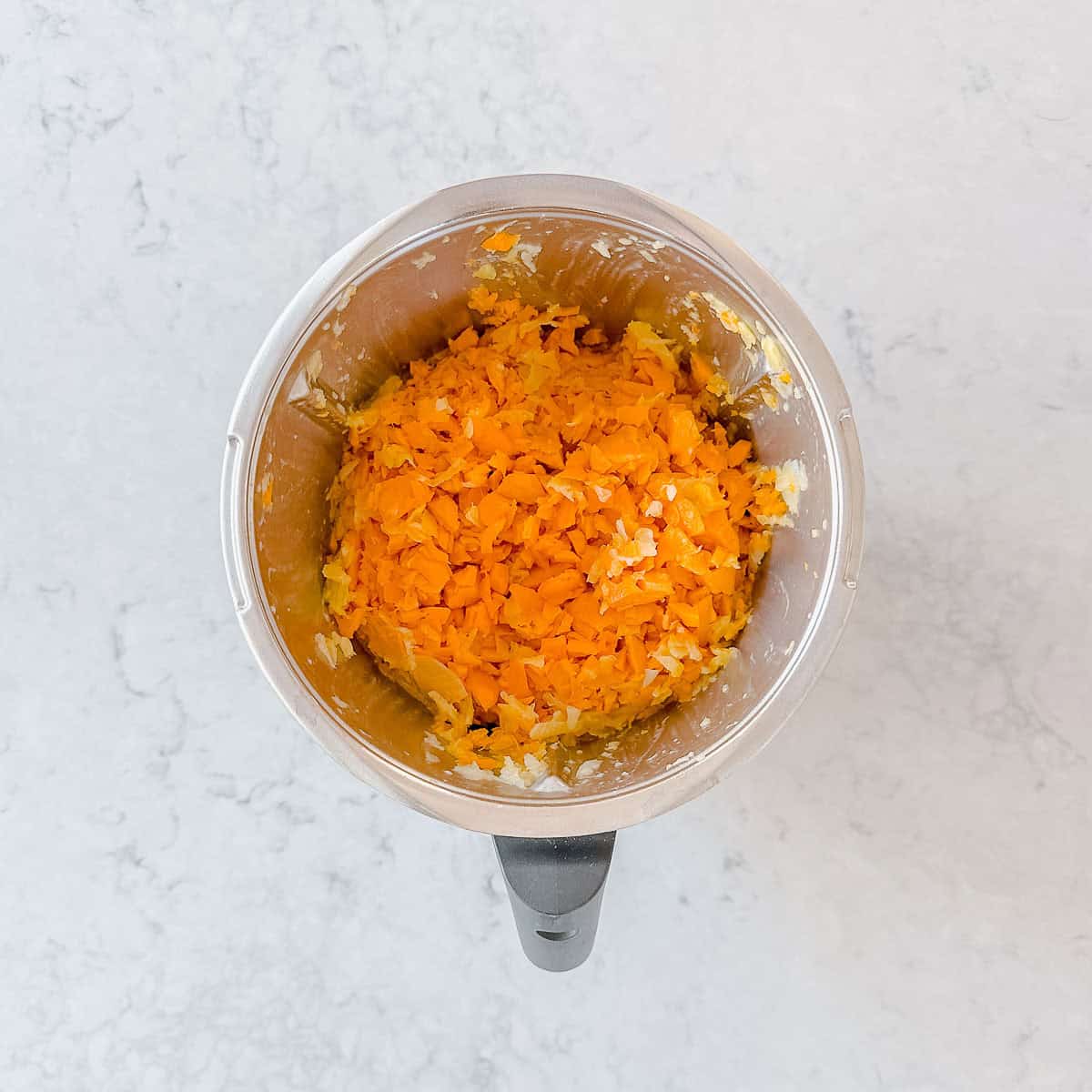 Chopped pumpkin in a Thermomix bowl.