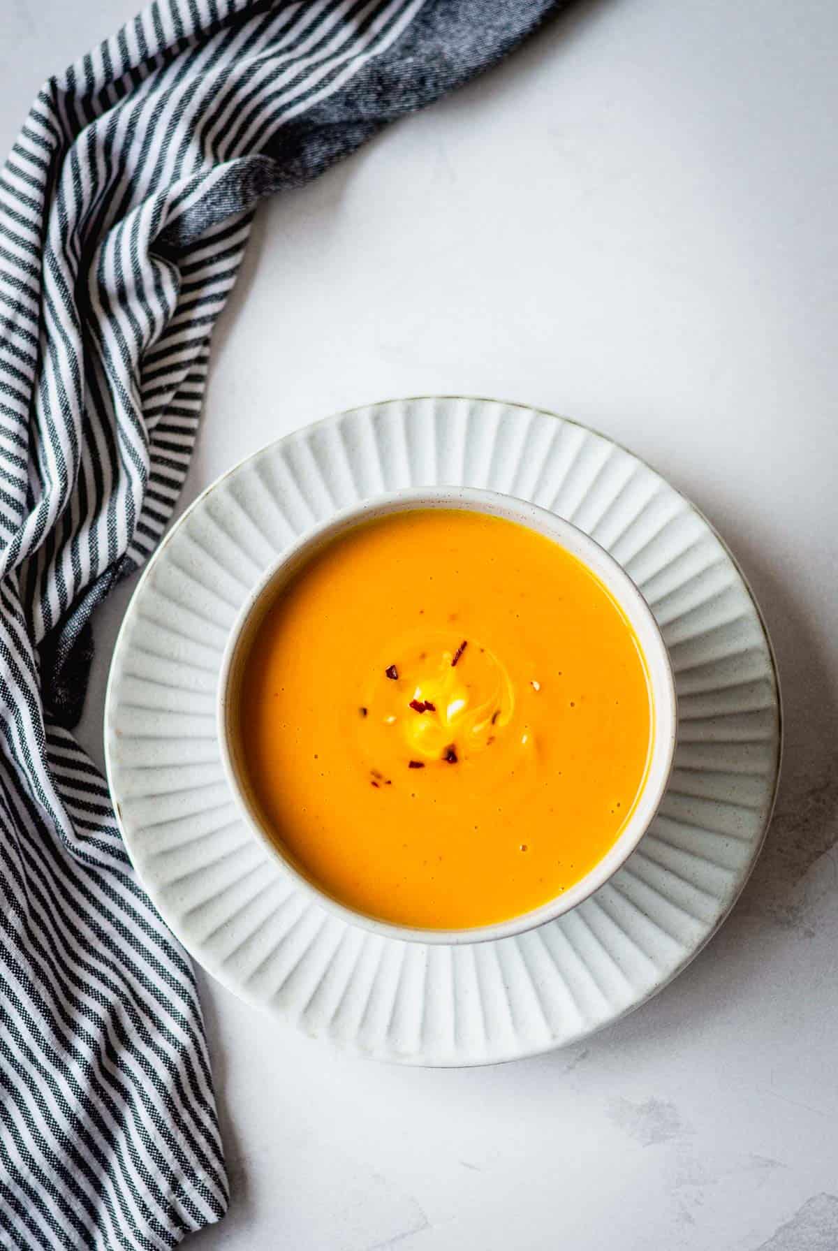 Overhead image of Thai Pumpkin Soup in a grey bowl.