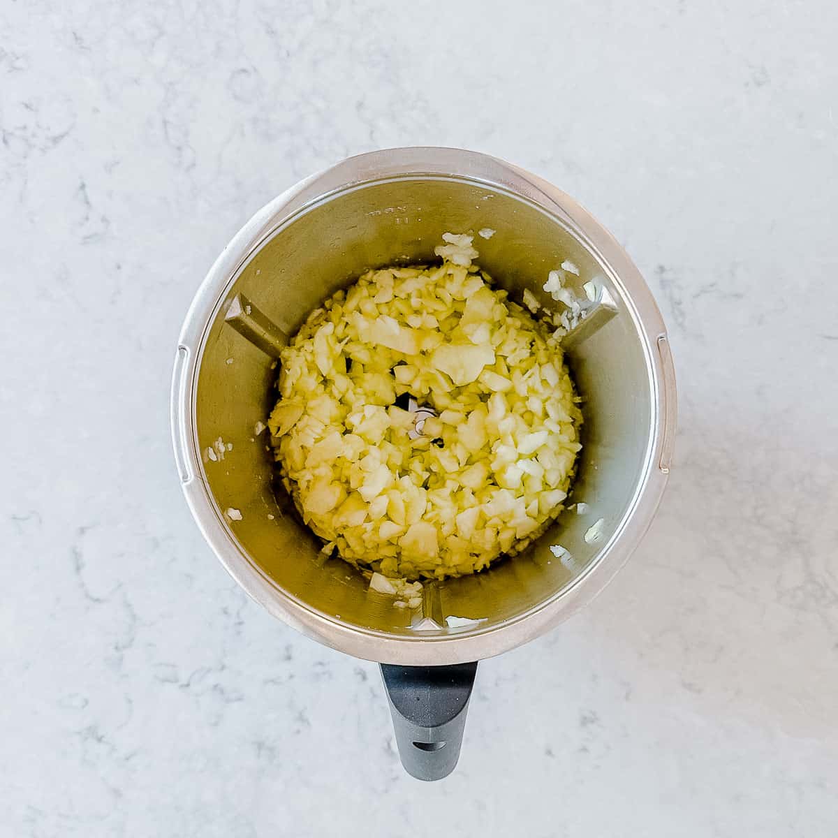 Chopped apples in a mixing jug.