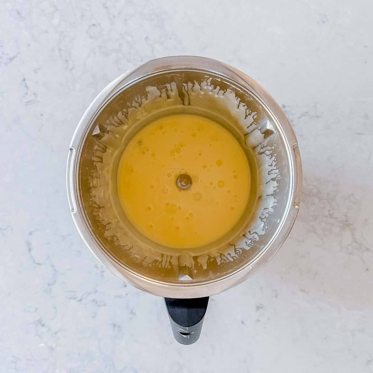 Yellow custard in a thermo bowl.