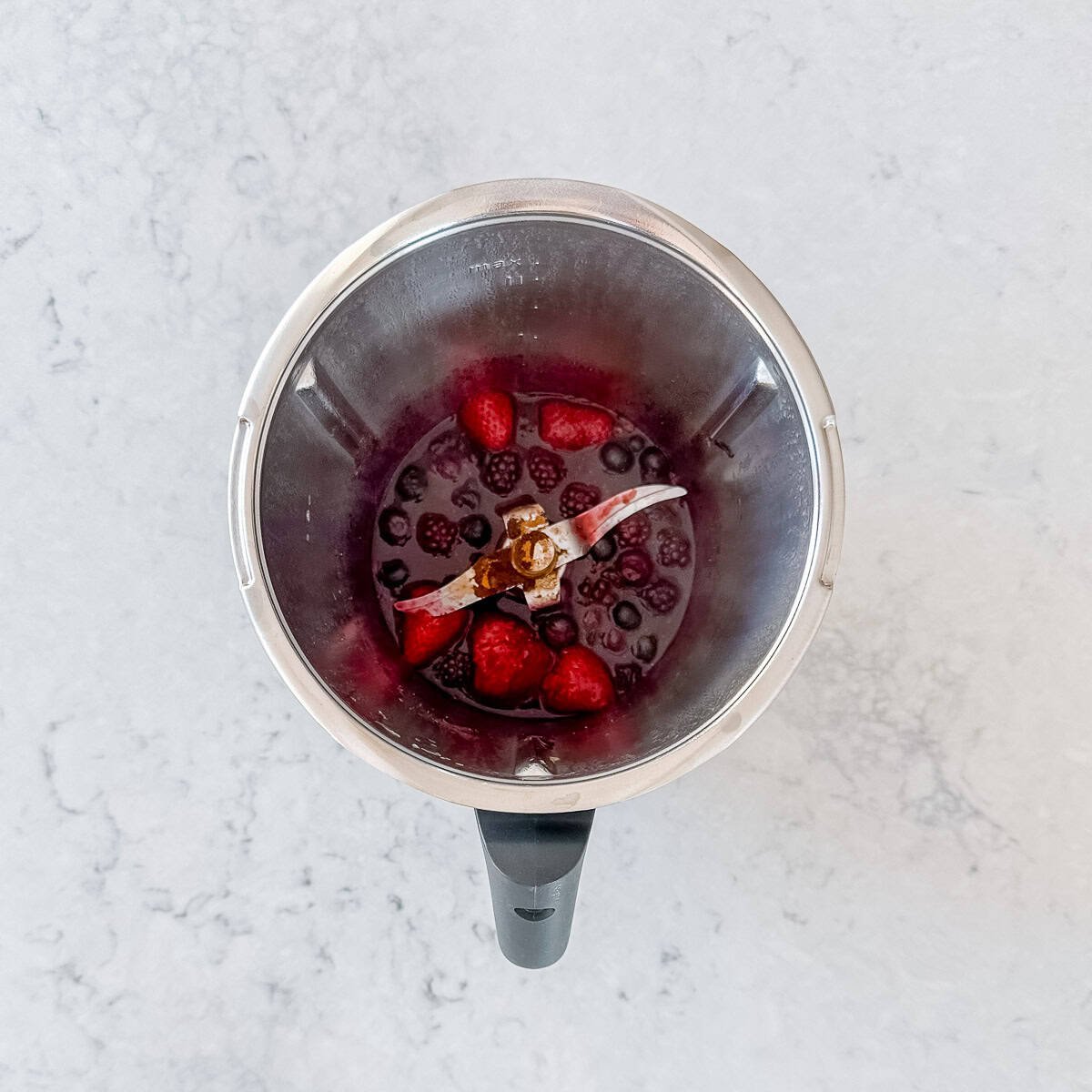 Mixed berry compote in a Thermomix bowl.