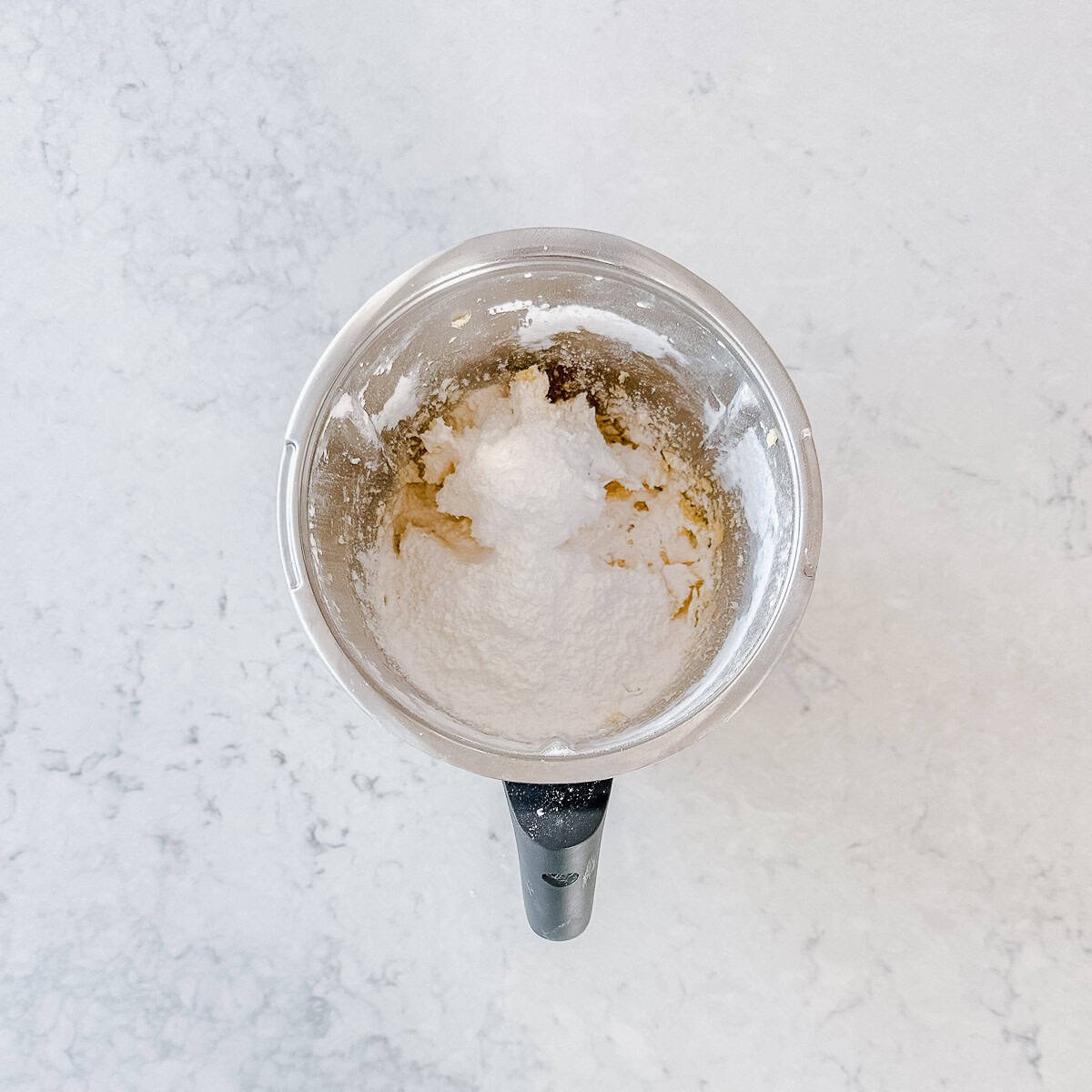 Melting moments mixture in a Thermomix bowl.