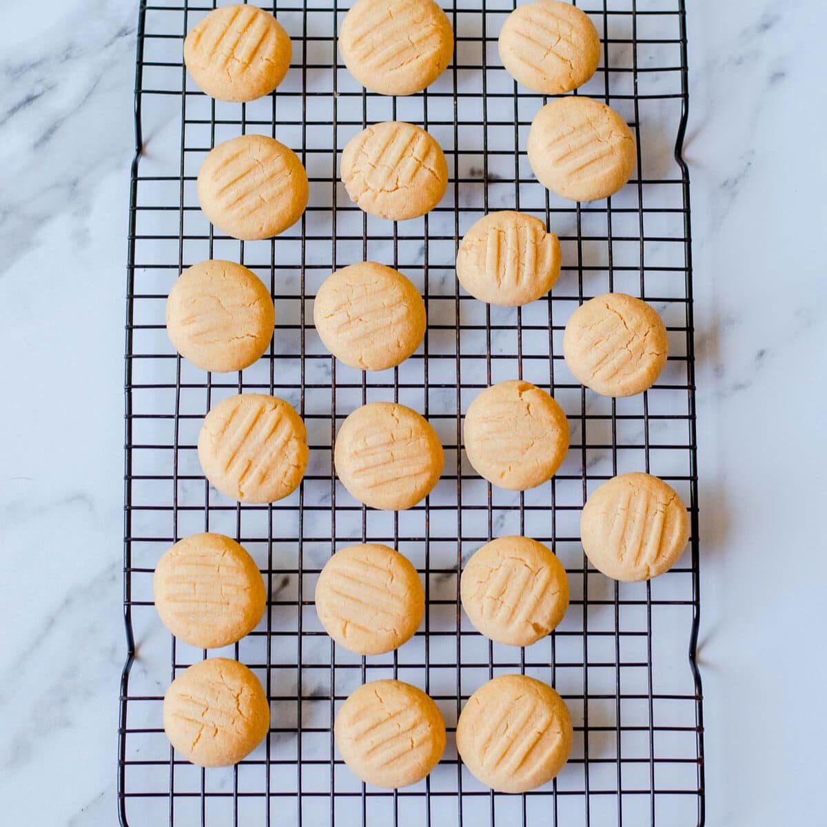 Baked Melting Moments on a wire rack.