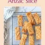 Anzac Slice bars on a baking rack.