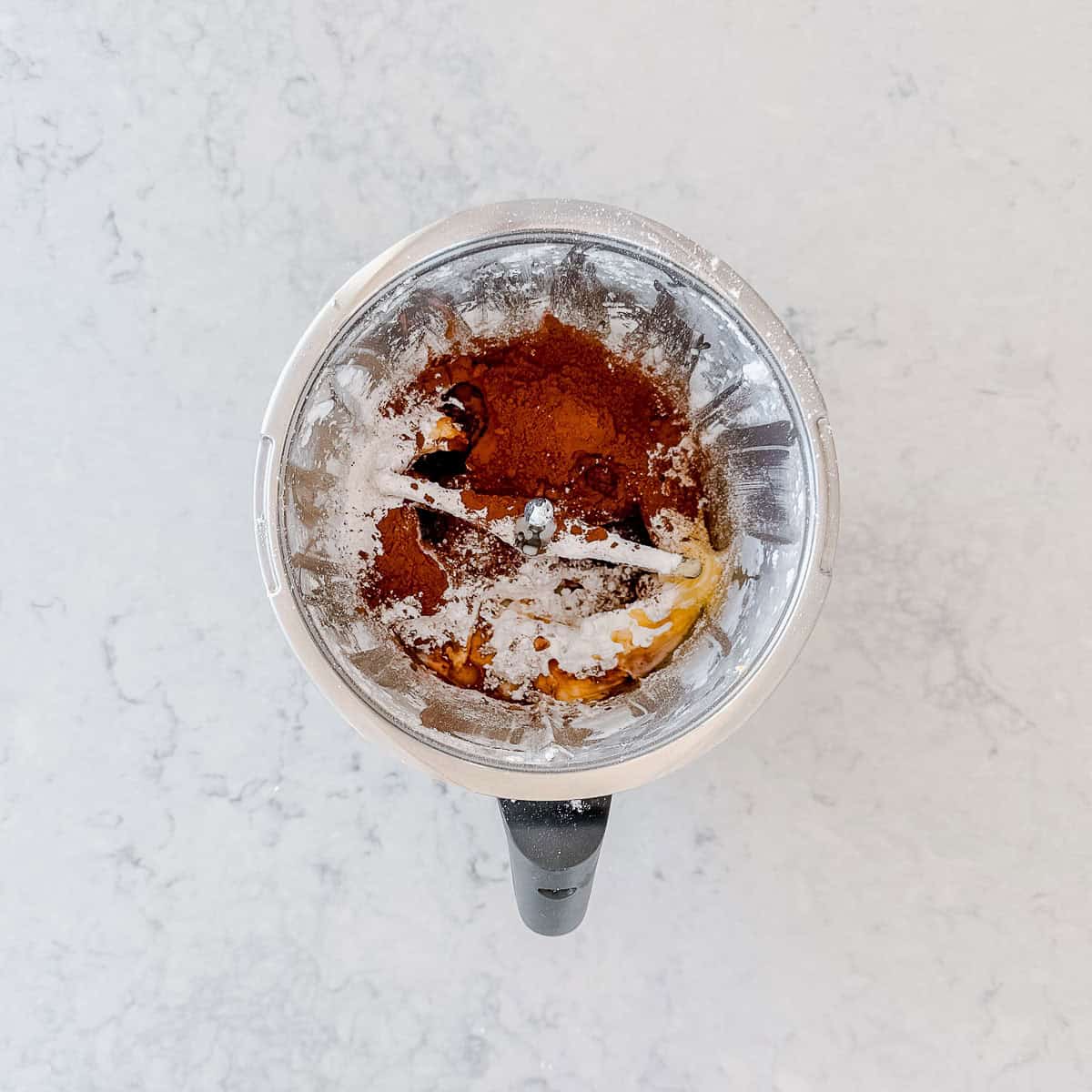 Cocoa powder and the remaining icing sugar added on top of the creamy butter mixture.